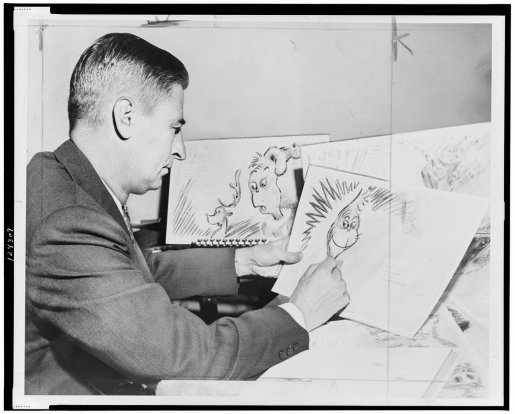 Photo of Dr. Seuss drawing the Grinch