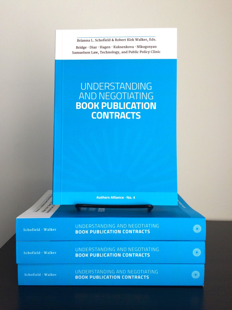 stack of blue publication contract books