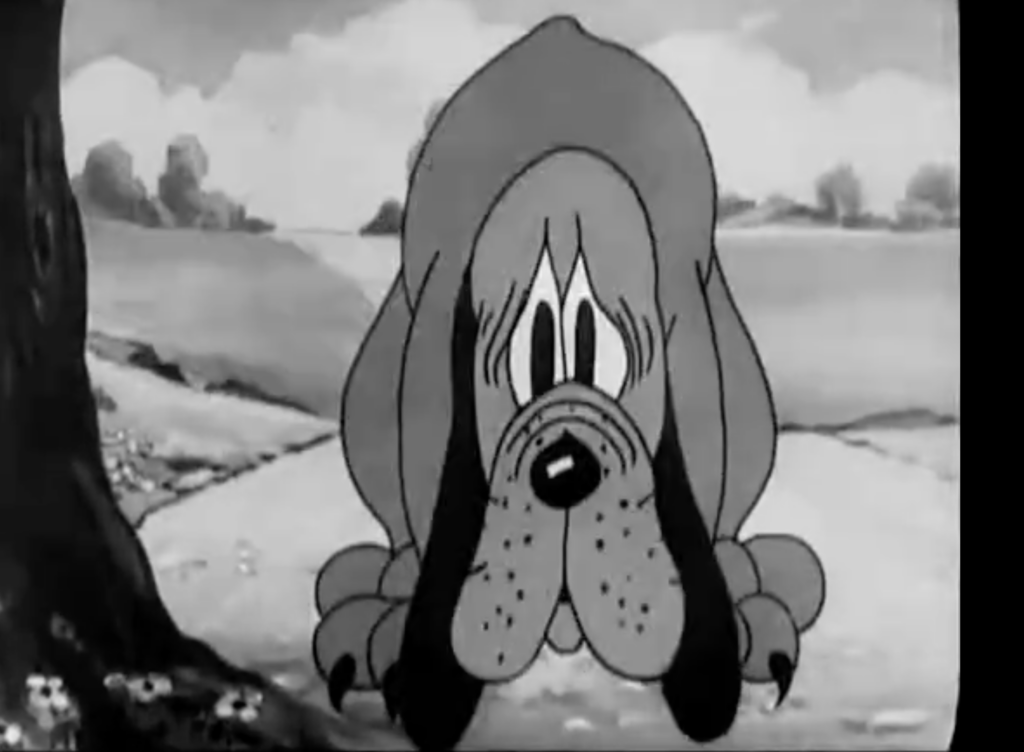 Black and white screenshot from an animated cartoon, showing the first appearance of Minnie Mouse's dog, Rover.